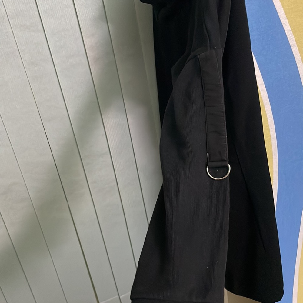 That is a sweatshirt. It is long and very black. - Picture 4 of 4
